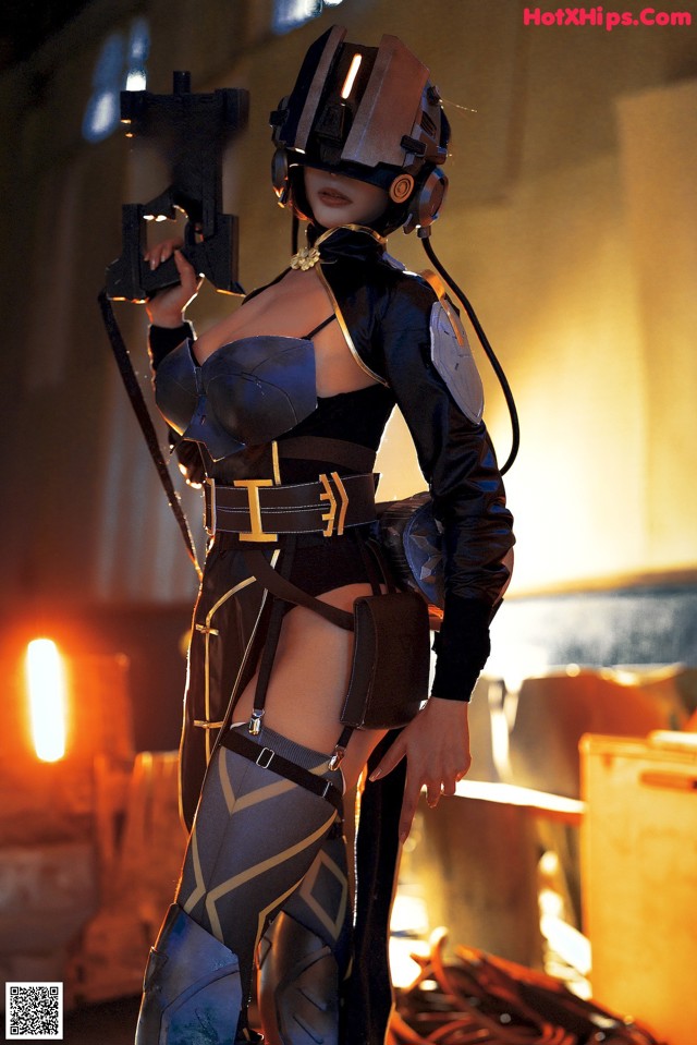 A woman in a futuristic outfit holding a gun.