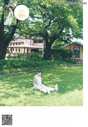 A young woman sitting on a wooden bench.