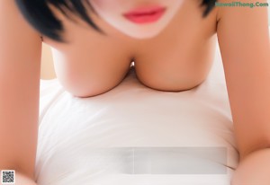 A woman in a white towel is posing for the camera.